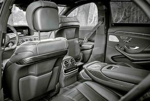 Modern car black leather interior background,  inside luxury city car photo