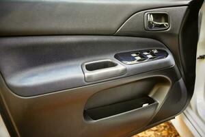 Modern city car door,  opened car door close view photo