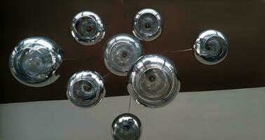 Modern chandelier background, round lamps over ceiling pattern photo