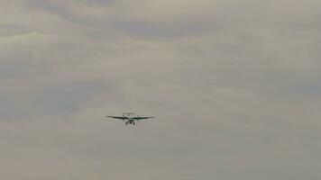 Commercial turboprop aircraft approaching landing, front view. Aircraft in the sky video