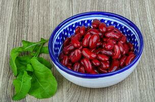 Kidney beans over wooden photo