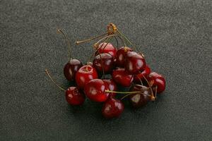 Ripe sweet cherry berries heap photo