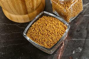 Mustard dry seeds in the bowl photo