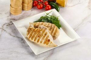 Grilled chicken breast served arugula photo