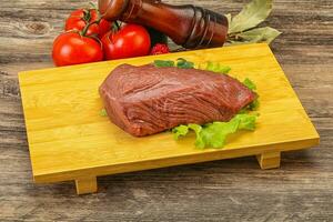 Raw beef cut for cooking photo