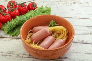 Mini sausages with pasta spaghetti photo