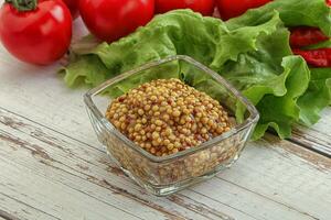 Mustard seeds sauce in the bowl photo