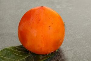 Fresh ripe sweet juicy persimmon photo