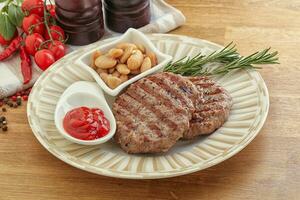 Grilled beef burger cutlet with sauce photo