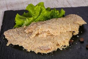 Raw pork schnitzel photo