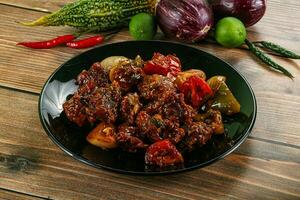 Asian cuisine - pork with chili sauce photo