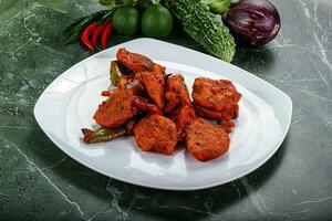 Indian cuisine - chicken tikka barbecue photo