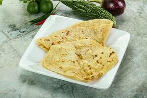 Indian tandori bread - naan with cheese photo