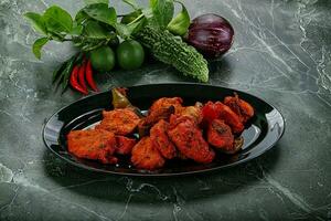 Indian cuisine - chicken tikka barbecue photo