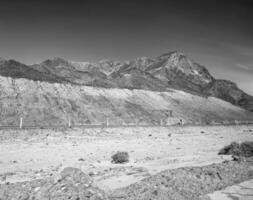 Road going through Sinai mountains, hills and desert photo