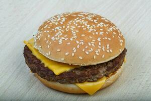 Hamburger on wooden background photo