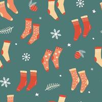 Seamless pattern with warm socks. Winter cozy pattern with snowflakes. Vector graphics.