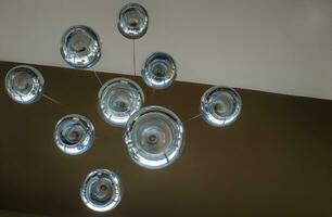 Modern chandelier background, round lamps over ceiling pattern photo