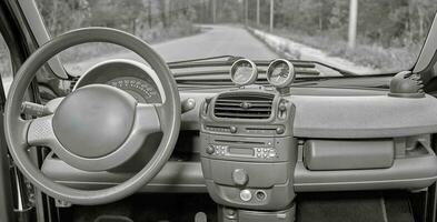 Car steering wheel and interior background, modern city car elements close view. Car inside interior photo