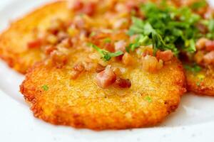 Potato pancakes with bacon photo