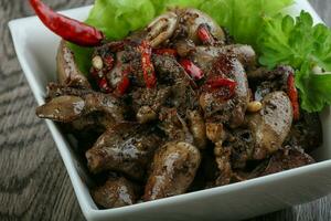 Baked chicken hearts and liver photo