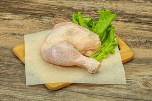 Raw chicken leg for cooking photo