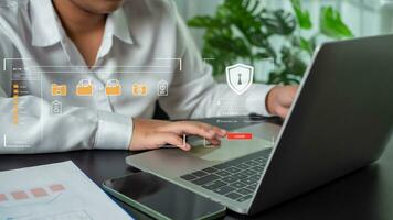 Businesswoman using computer to login represents protection concept of cyber security and data security including secure login. photo