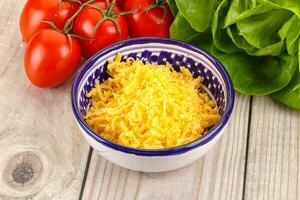 Shredded cheese in the bowl photo