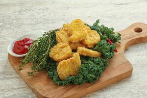 Crispy chicken nuggets with tomato ketchup photo