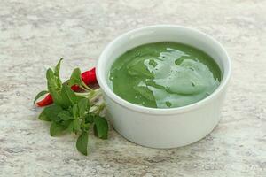 Green chili pepper and lime sauce photo