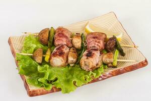 Bacon wrapped grilled Scallops with mushrooms and bacon photo