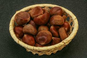 Chestnut heap in the bowl photo