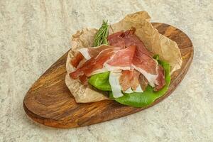 Delicous Spanish Hamon slices pork meat photo