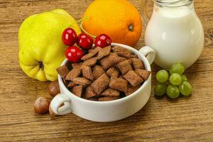 Breakfast with corn chokolate pads and milk photo