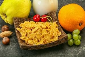 Breakfast with corn flakes and milk photo