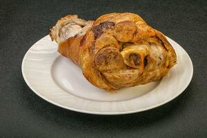 Baked pork knuckle with spices photo