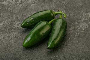 Green raw jalapeno peper heap photo