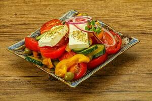 Traditional Greek salad with feta cheese photo