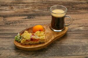 Crust pie with apricot served coffee photo