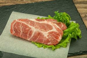 Raw pork meat neck steack photo