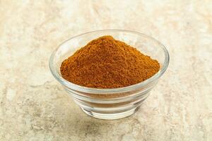 Dry Paprika powder in the bowl photo