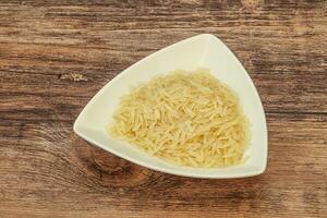 Raw basmati rice in the bowl photo