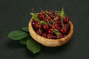 Sweet ripe cherry with leaves photo