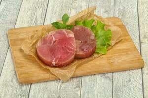 Raw tuna round steak for grill photo