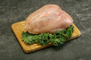 Whole skinless chicken breast fillet photo