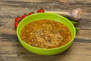 Caucasian Kharcho soup with beef meat photo