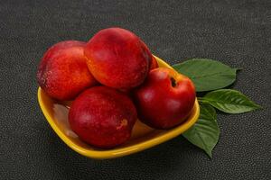 Sweet tasty ripe few nectarines photo