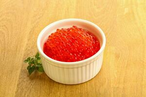Red caviar in the bowl photo