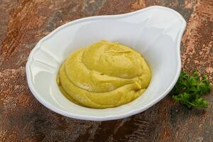 Mustard sauce in the bowl photo