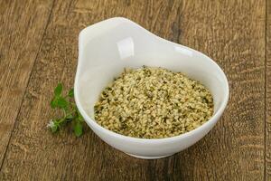 Peeled hemp seeds in the bowl photo
